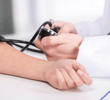 Blood pressure machine on patient arm