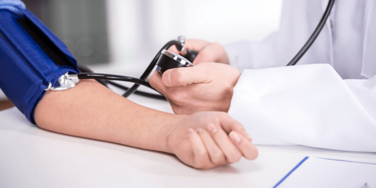 Blood pressure machine on patient arm