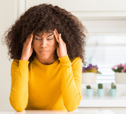 Person rubbing temples