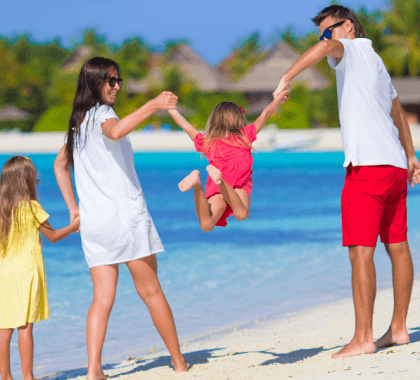 Family on sunny beach