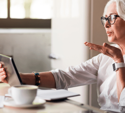 Person talking to their tablet