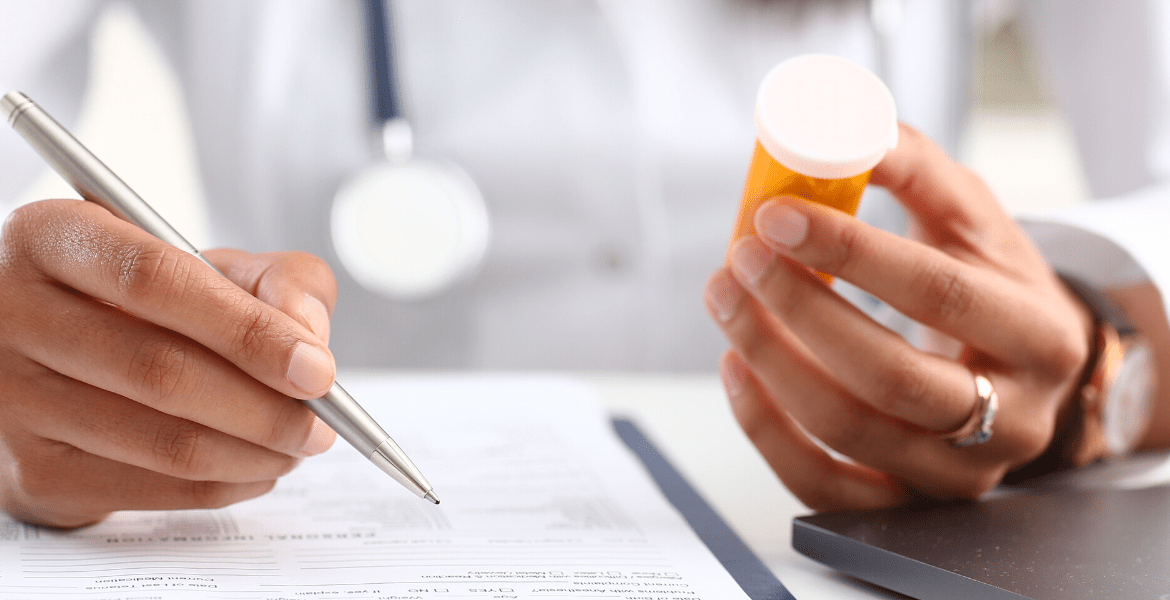 Doctor writing about medicine