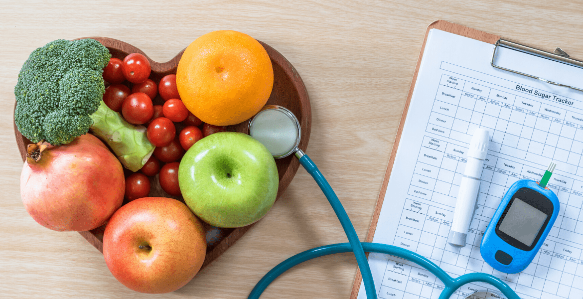Stethoscope in a heart-shaped bowl of fruit