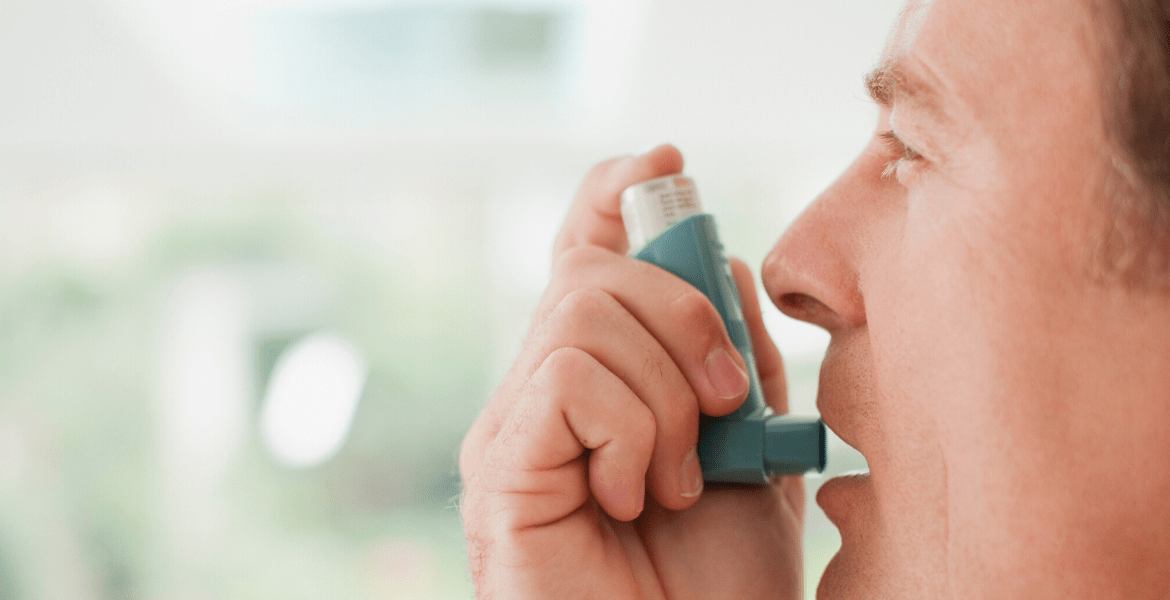 Person using an inhaler