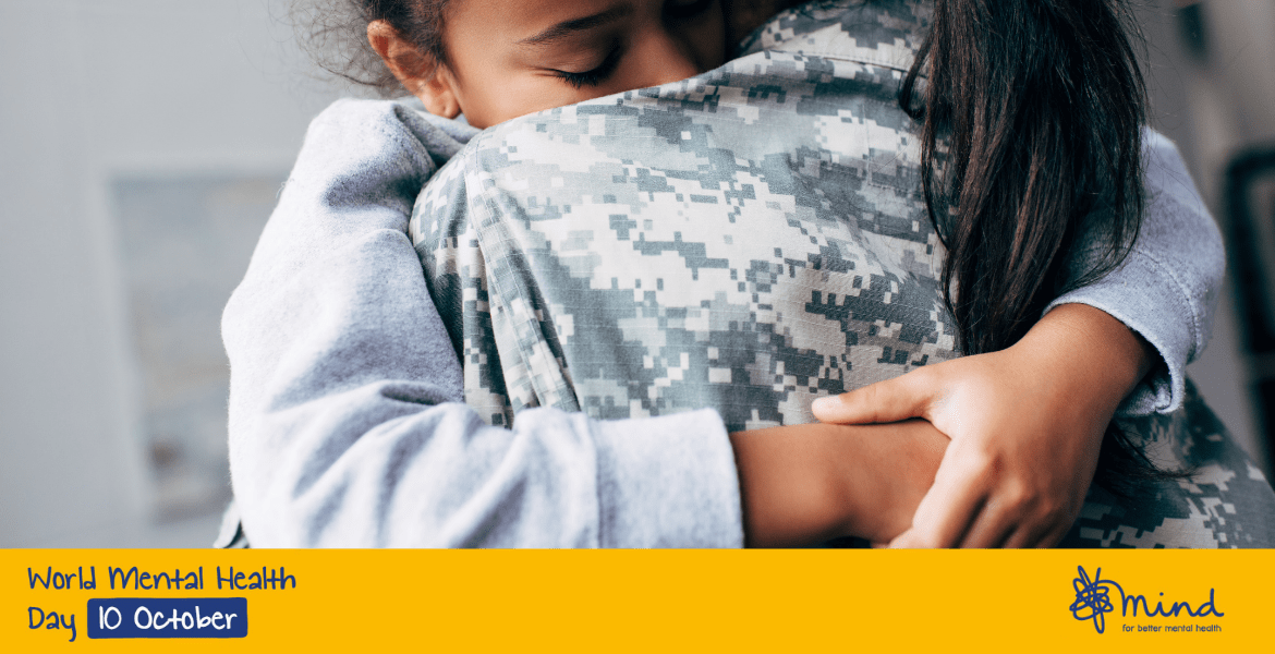 Two people hugging with banner: "World Mental Health Day"