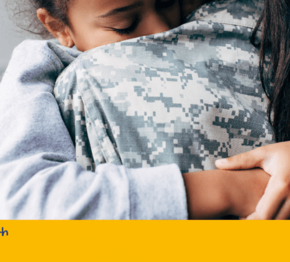 Two people hugging with banner: "World Mental Health Day"