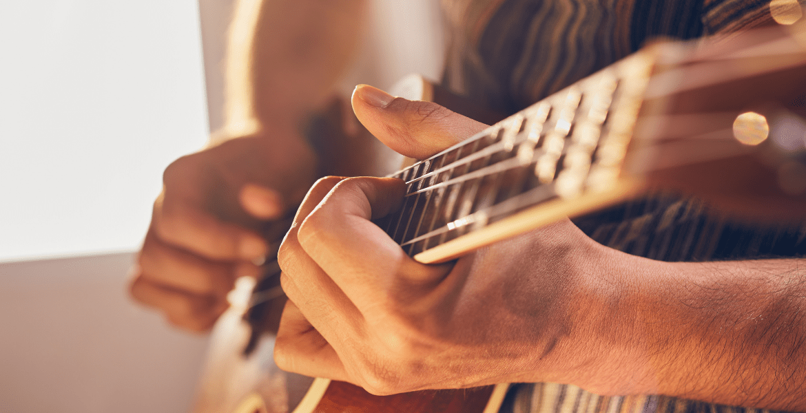 Guitar being held by hands