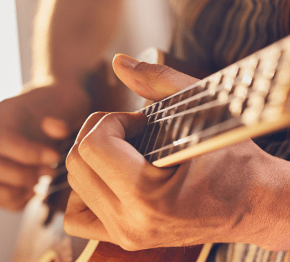 Guitar being held by hands