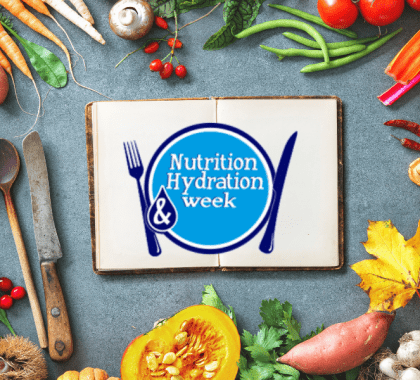 Book with "Nutrition & Hydration Week" logo surrounded by variety of foods