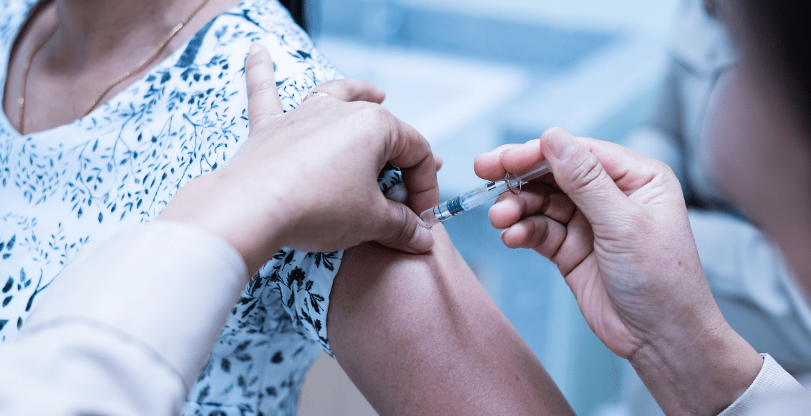 Arm being injected with vaccine