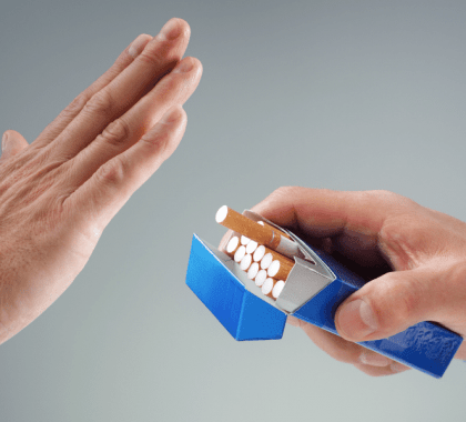 Person rejecting packet of cigarettes