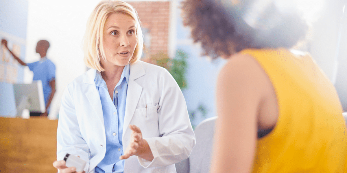 Pharmacist talking with patient