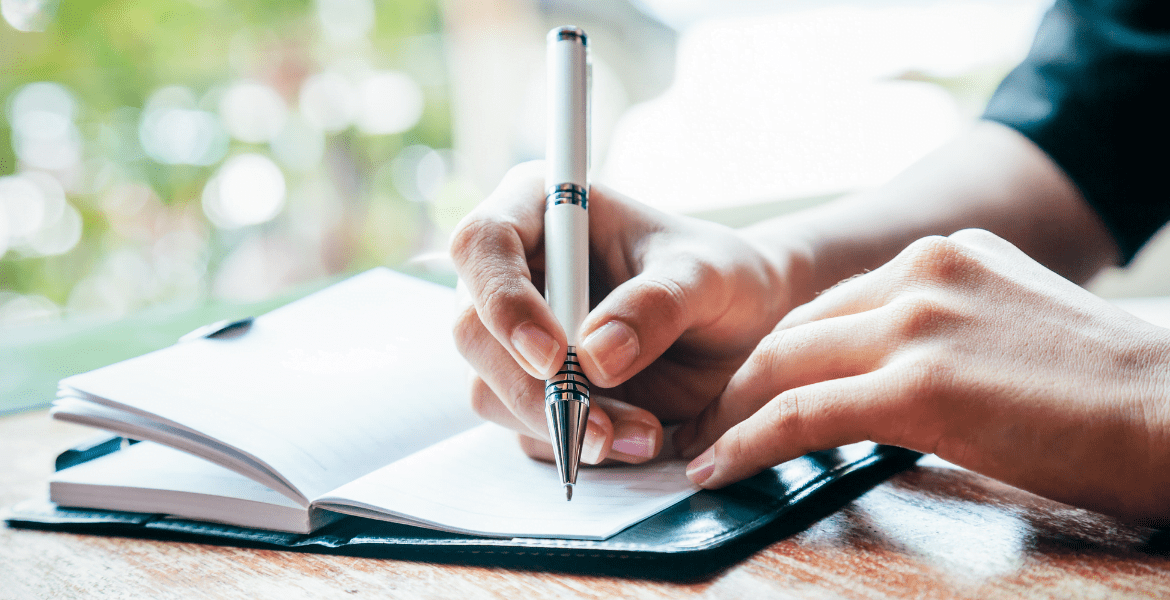 Person writing in a journal
