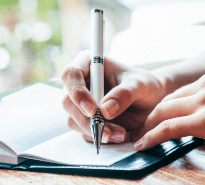 Person writing in a journal