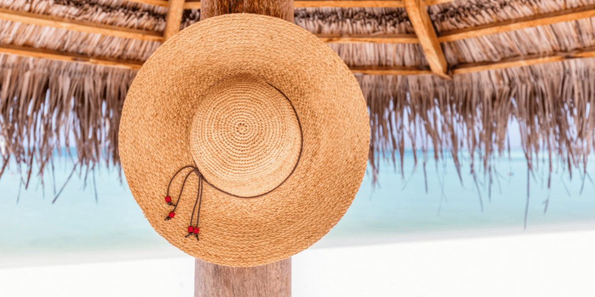 sun hat hanging on a beach