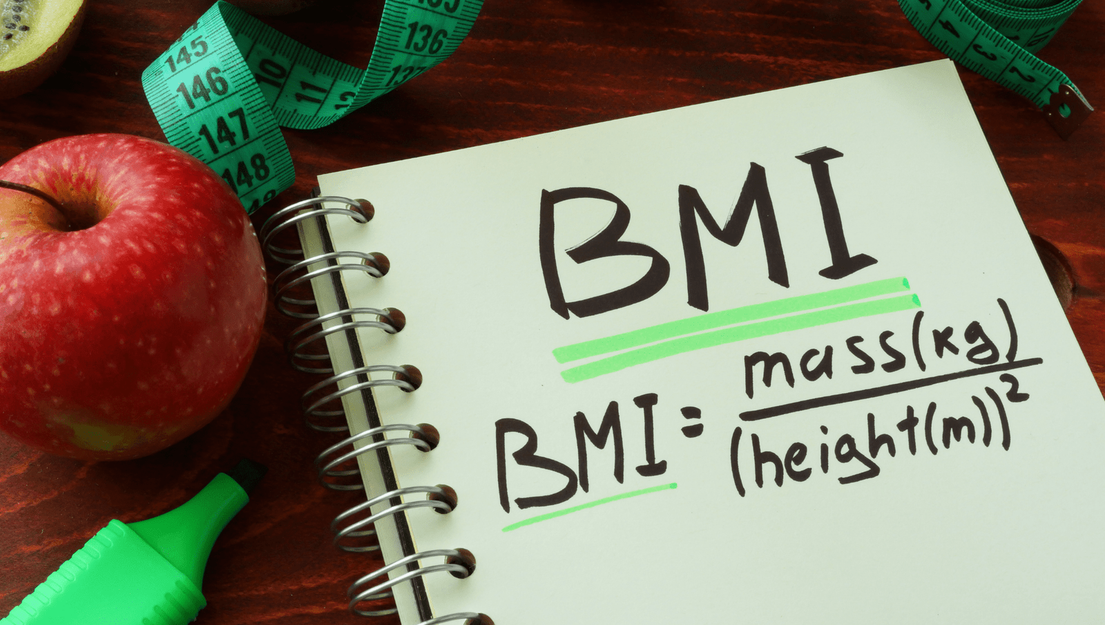 A notebook with BMI calculations written on it