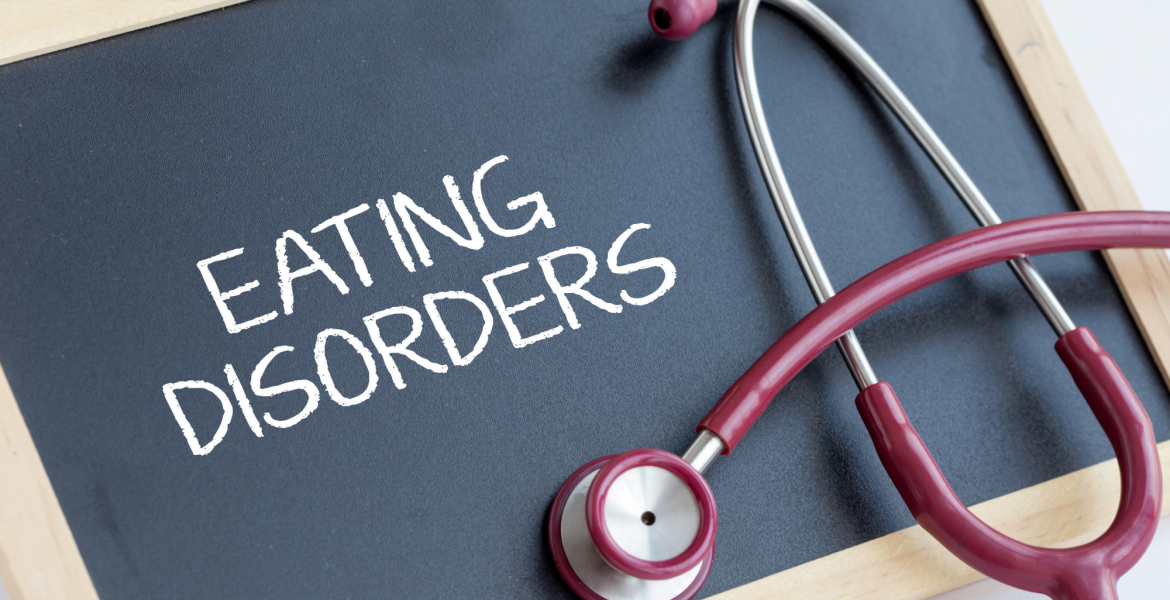 Chalkboard with "Eating Disorders" written on it with a stethoscope on top