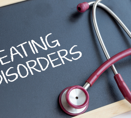 Chalkboard with "Eating Disorders" written on it with a stethoscope on top