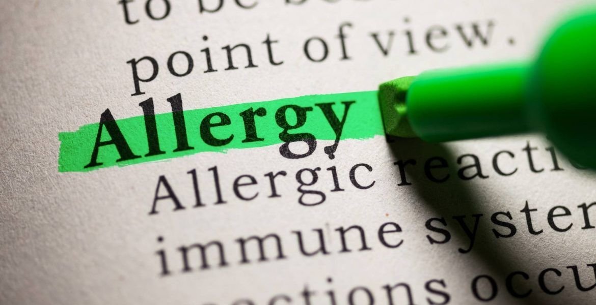 The word 'allergy' highlighted in a book