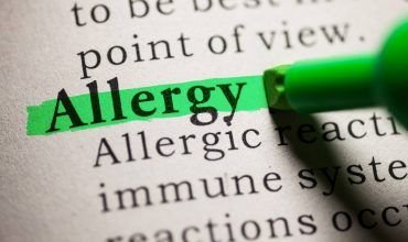 The word 'allergy' highlighted in a book