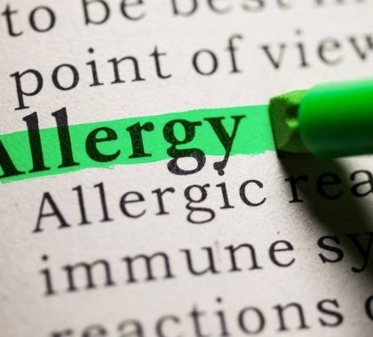 The word 'allergy' highlighted in a book